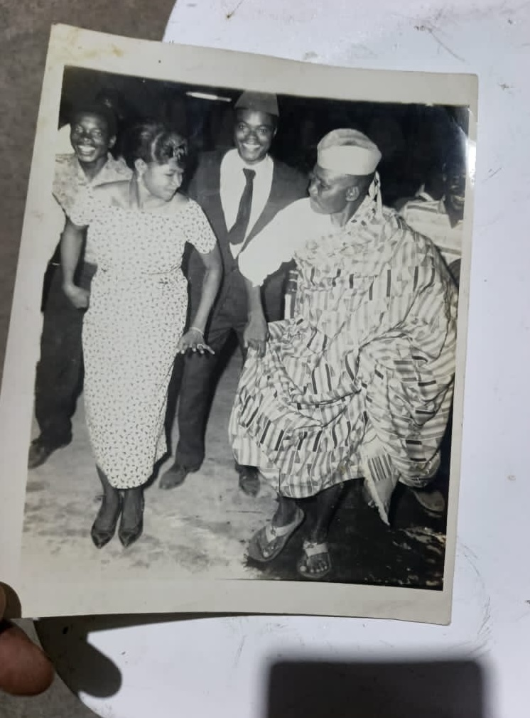 Olu dancing Agbadza while his brother Papavi (CY Tay looks on