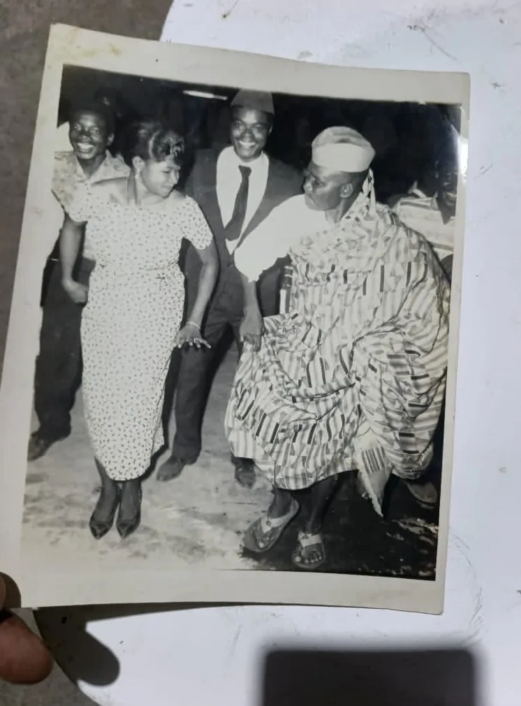 Olu dancing Agbadza while his brother Papavi (CY Tay looks on